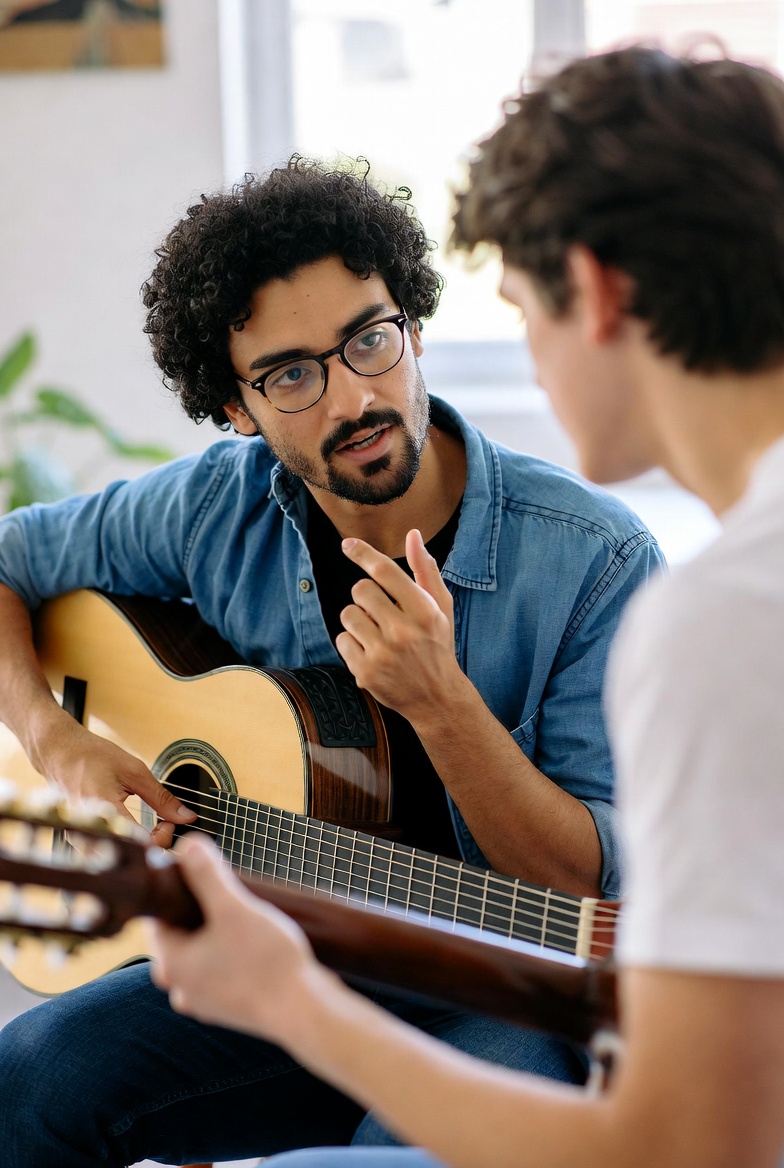 A music tutor teaching a private lesson with a student using sheet music, an instrument, and a calm practice space